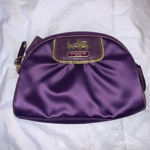 Purple Coach cosmetic pouch